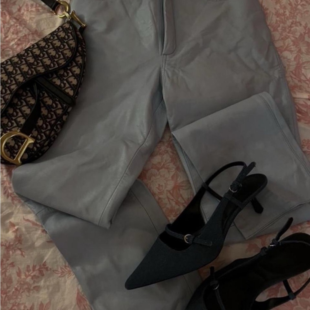 Vintage 70s blue genuine leather pants with a slight flare at the bottom.